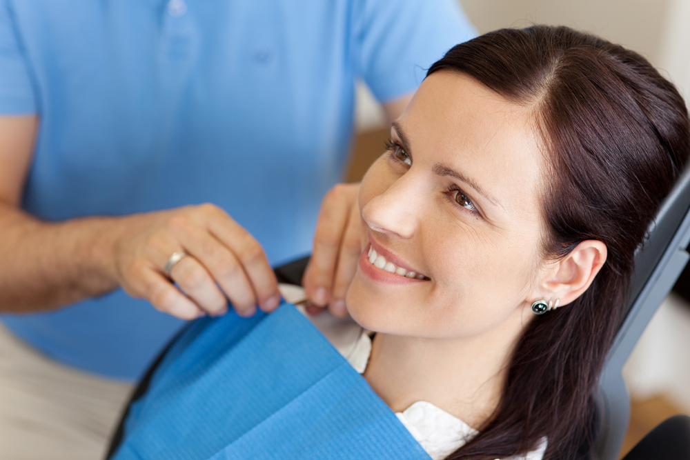 patient smiling in dental chair