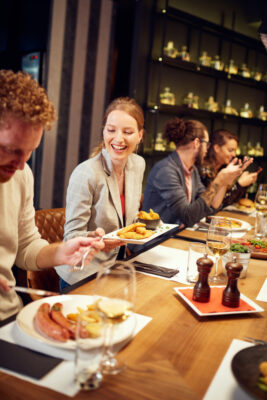 people smiling at a restaurant
